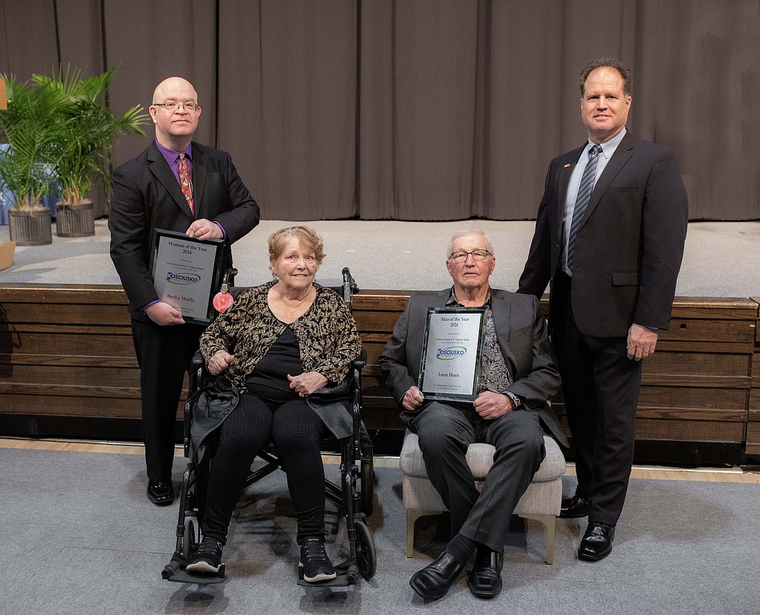 The 2024 Woman and Man of the Year are (L to R), sitting: Becky Walls and Leon Horn, respectively, presented by sponsors, standing: David Slone, Times-Union, and Doug Hanes, 1st Source Bank. Photo by Lauren Klusman Twombly, Kosciusko Chamber of Commerce