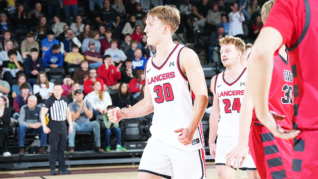 Pictured is Gage Sefton celebrating a second-half run during Grace's win over Indiana Wesleyan on Wednesday.