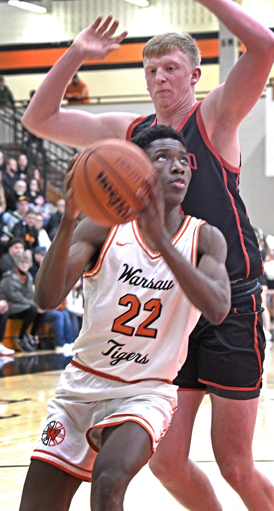 Warsaw junior Mydin Burgher eyes the basket to score during Friday night's home game against NorthWood...Nieter