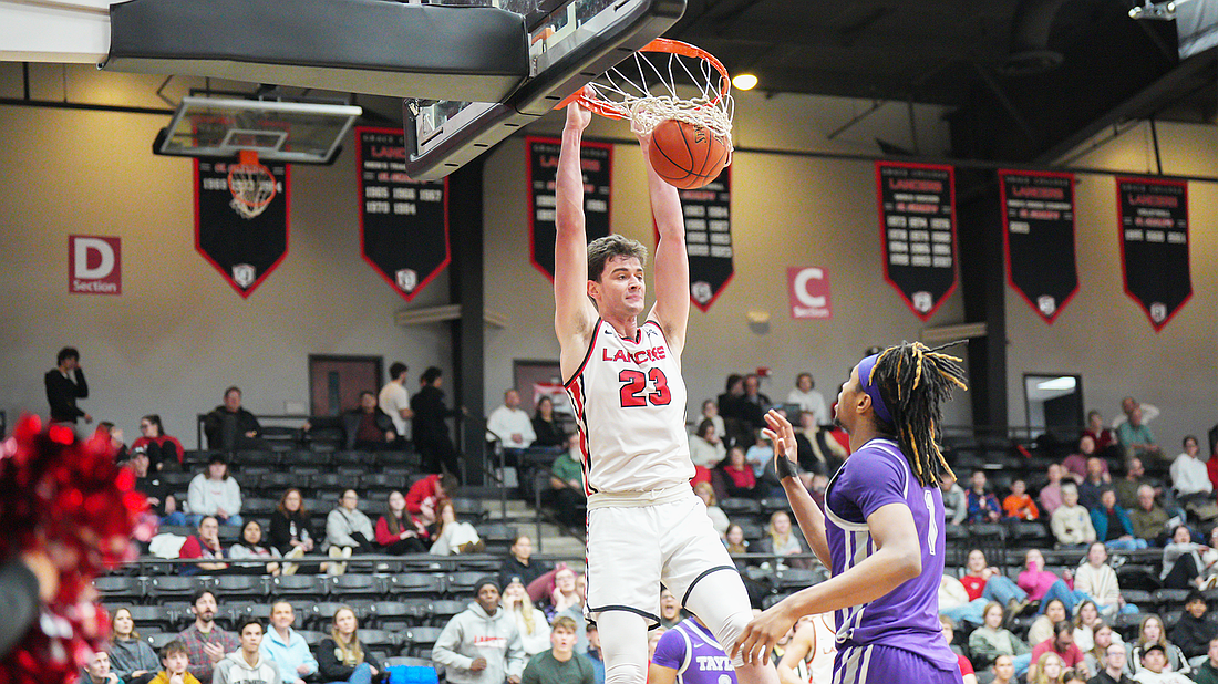 Pictured is Ian Scott dunking during the second half of Grace's OT win over Taylor on Wednesday