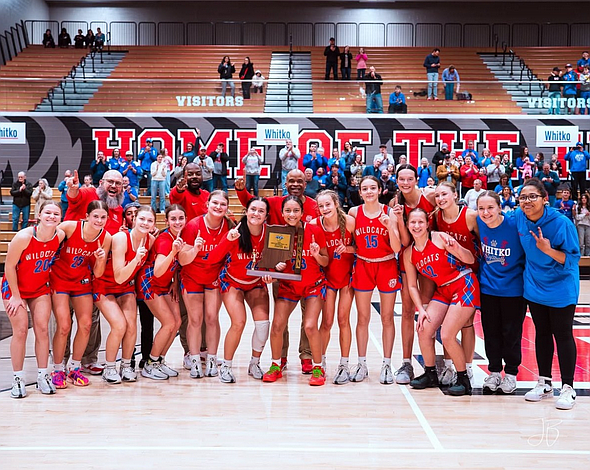 The Whitko girls basketball team celebrates after winning its first sectional championship in school history at Bluffton Saturday.