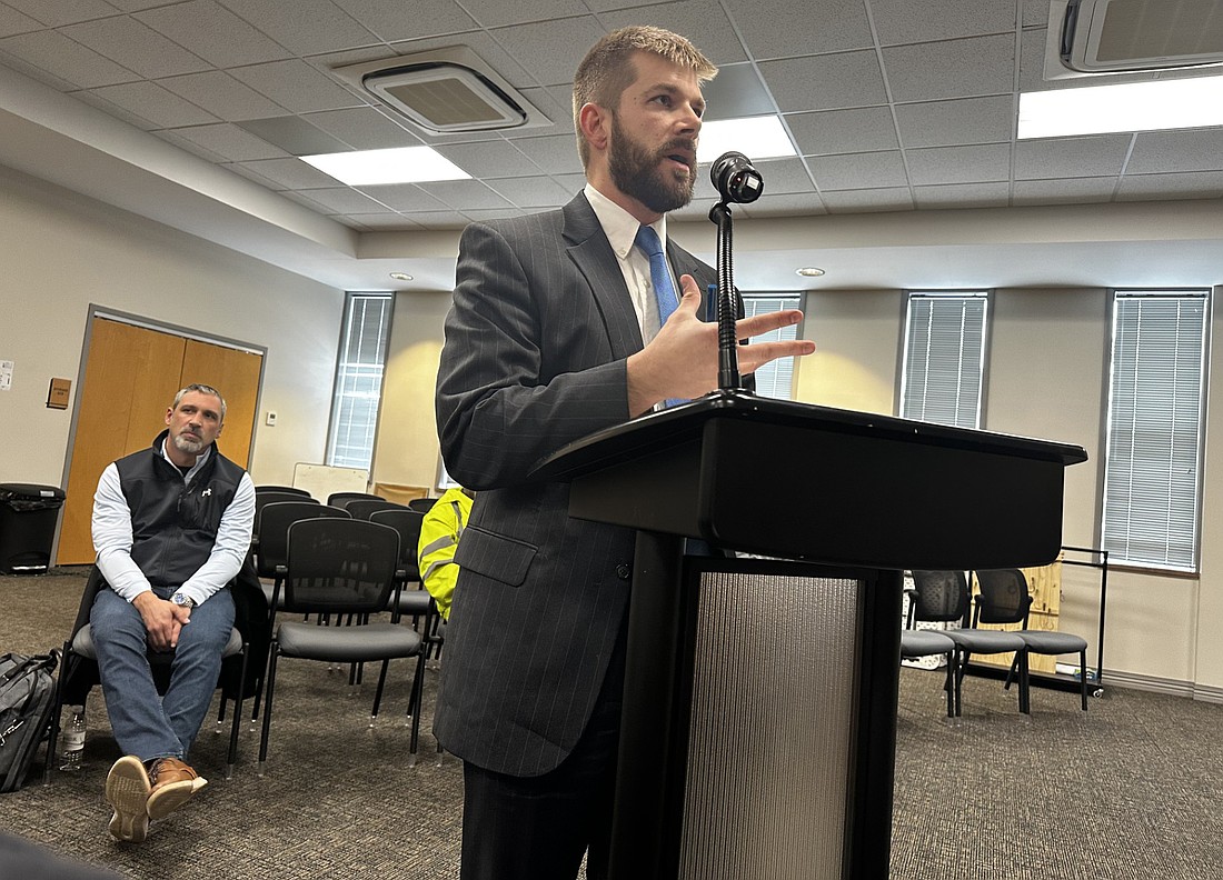 Andy Mouser (R), financial advisor with Baker Tilly, explains the proposed financing of the Warsaw Public Works building project to the Redevelopment Commission Tuesday as Public Works Superintendent Dustin Dillon (L) listens. Photo by David Slone, Times-Union