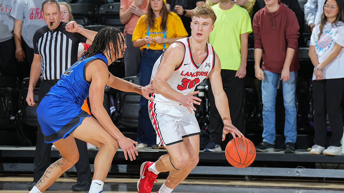 Pictured is Gage Sefton handling the ball during Grace's win over St. Francis on Wednesday