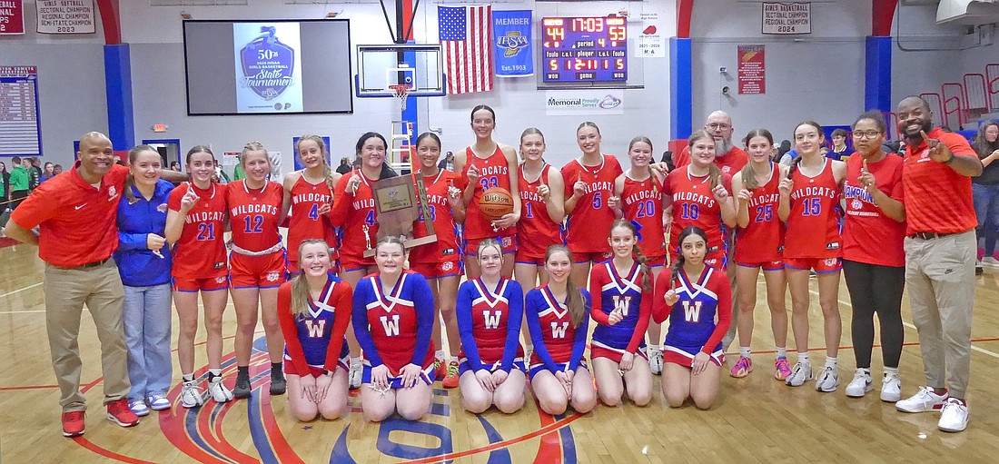 The Whitko girls basketball team celebrates after defeating Bremen 53-44 for the first regional title in school history last Saturday.