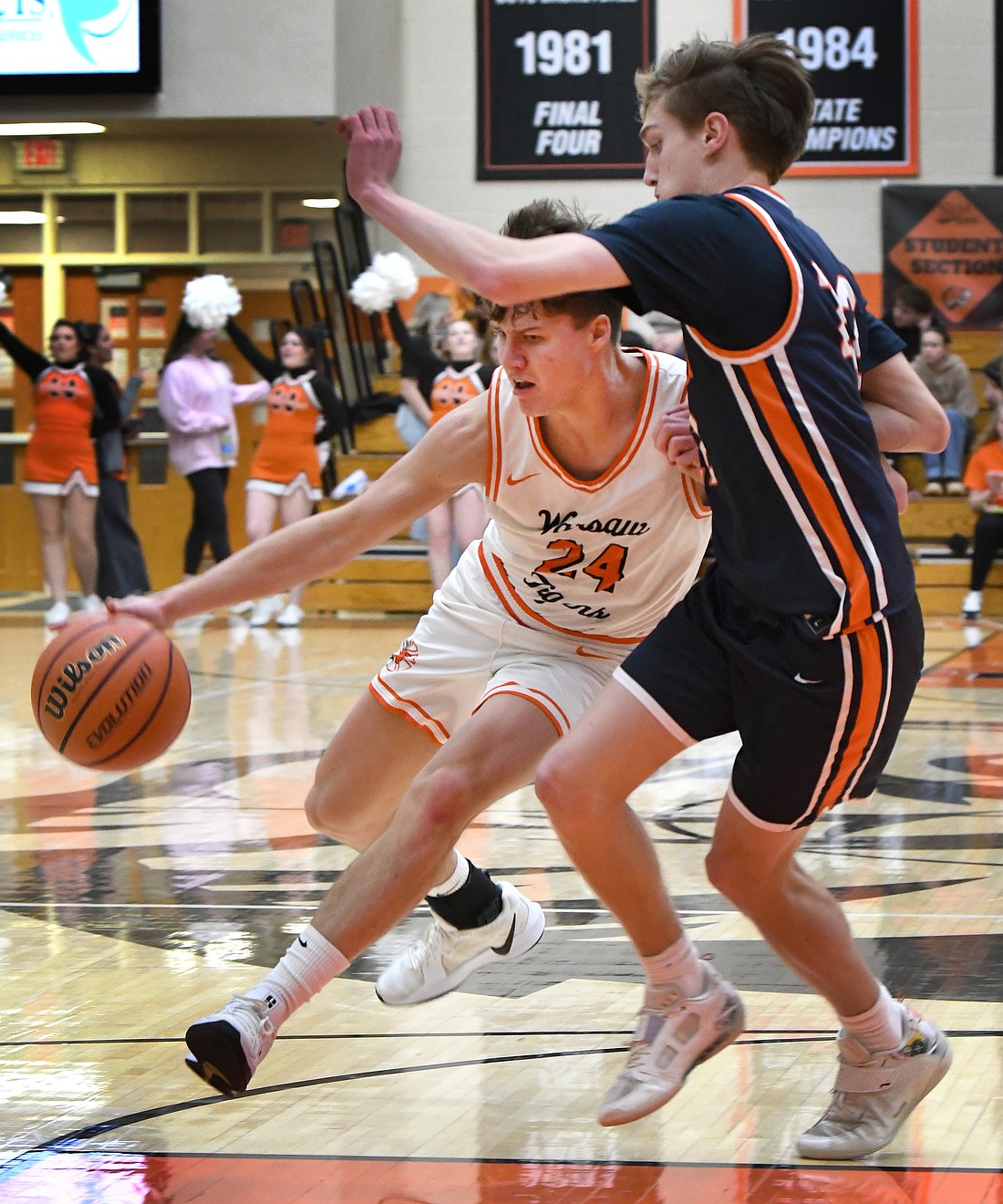 Senior Carson Gould of Warsaw drives toward the basket during the second quarter...Nieter