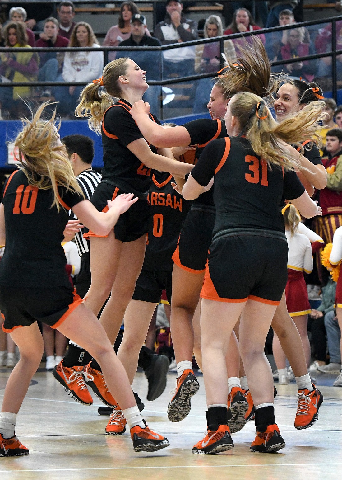 The Warsaw girls celebrate their win over McCutcheon...NIeter