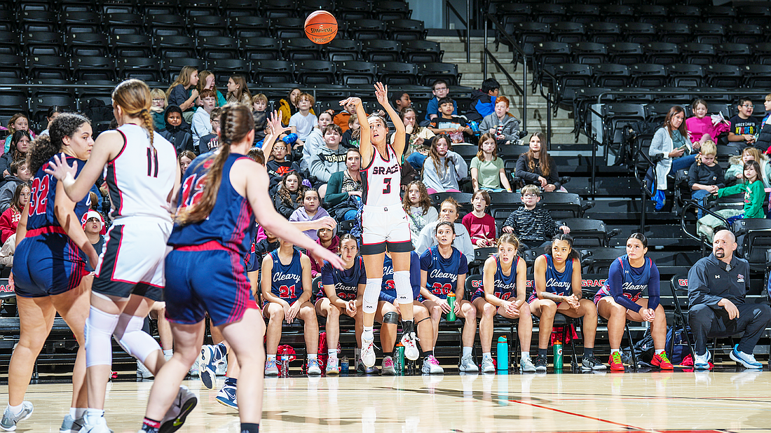 Grace’s Maddy Poynter lets a three fly in the Lady Lancers’ regular season finale Saturday. Photo by Jeff Nycz