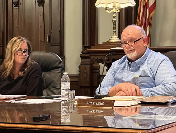 Mike Long, sitting next to Councilwoman Kathy Groninger, presides over the Kosciusko County Council in 2024. Long died in an accidental drowning Thursday. Photo by David Slone, Times-Union