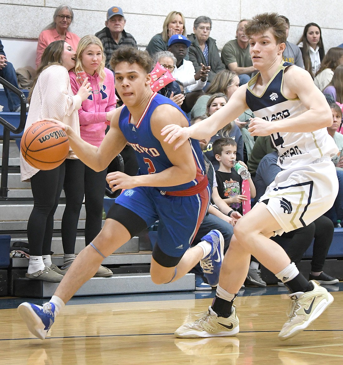 Whitko senior Jaylen Gibson breaks to the basket as Josiah Rice of LCA defends...Nieter