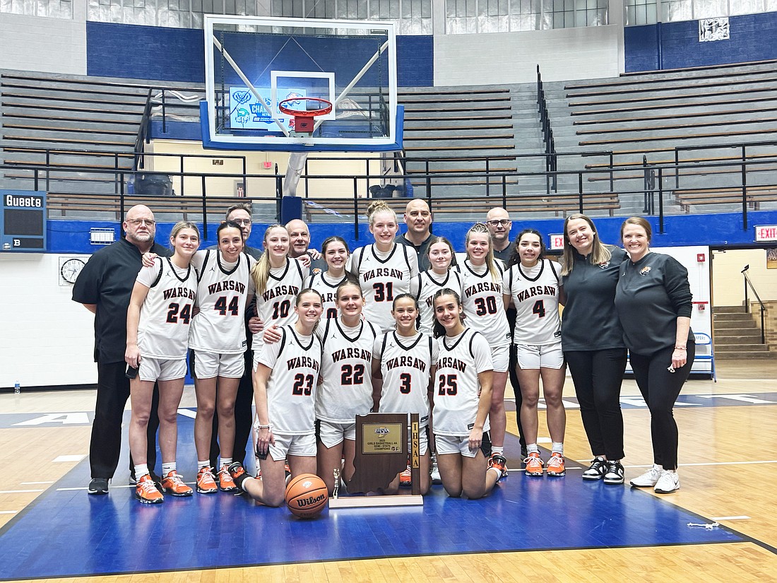 Pictured is the Warsaw girls basketball team with the Semi-State trophy it earned after defeating No. 1 Hamilton Southeastern last Saturday. The Lady Tigers will play for the state championship on March 1.