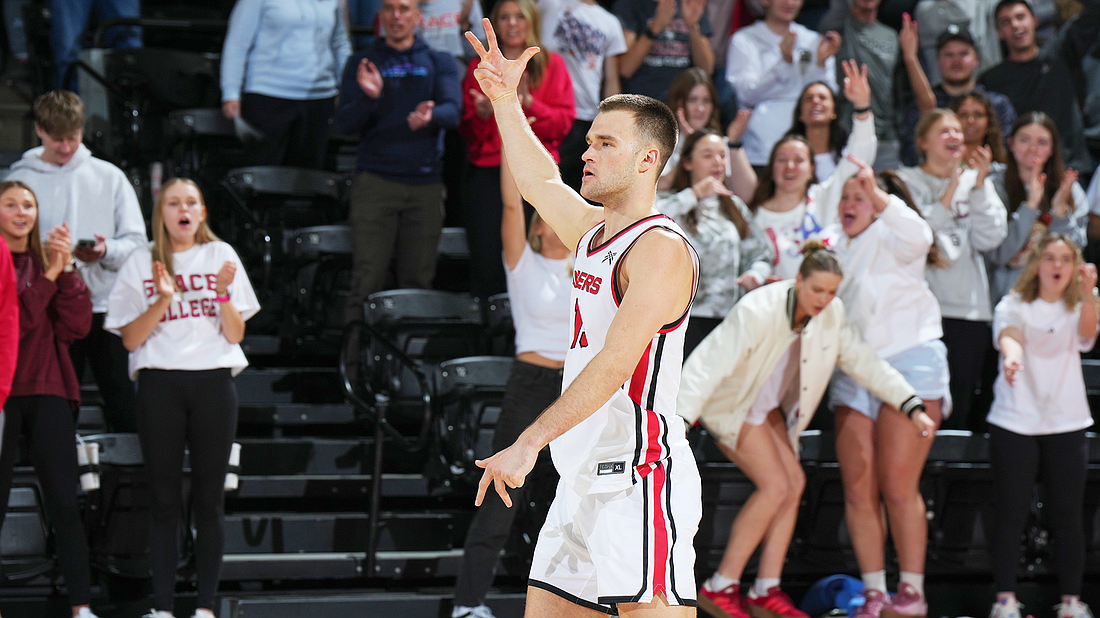 Pictured is Justin DeGraaf celebrating a second-half 3-pointer during Grace's semifinal win over Indiana Wesleyan