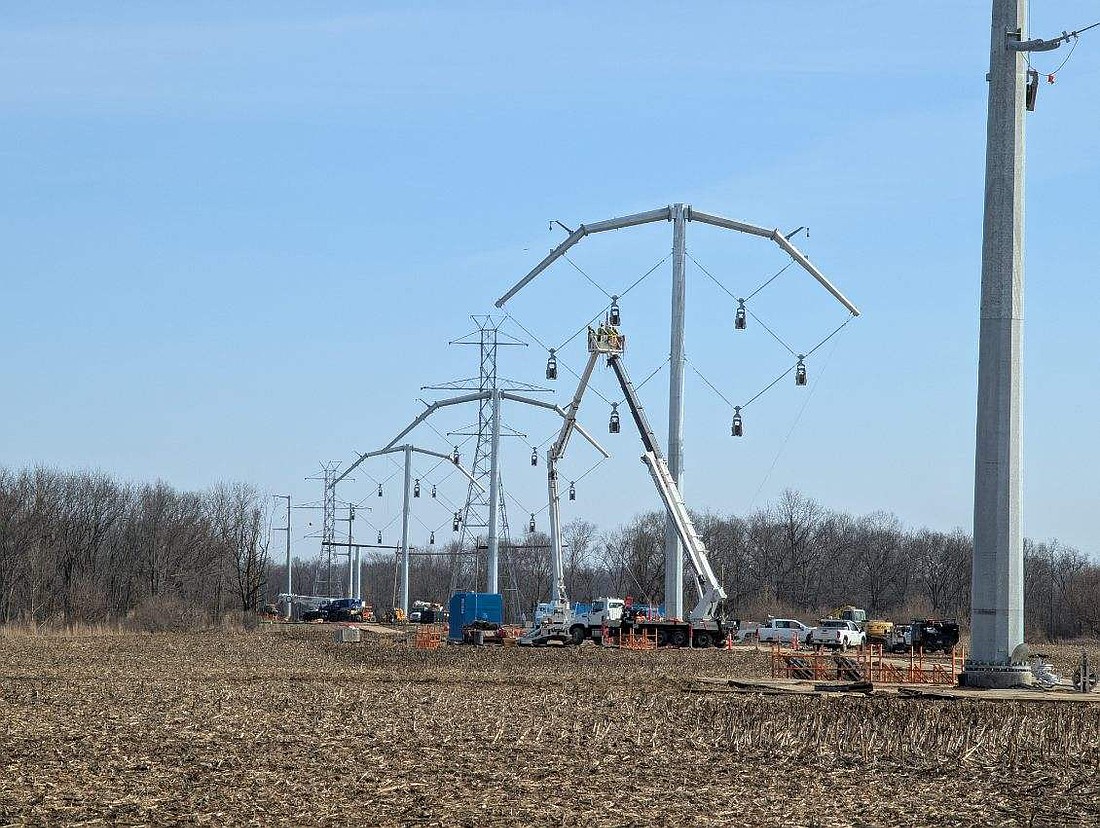 Shown in the front are the lower power lines east of the Warsaw Municipal Airport, with the taller original power lines in the far background. Photo by Nick King, Warsaw Municipal Airport Manager