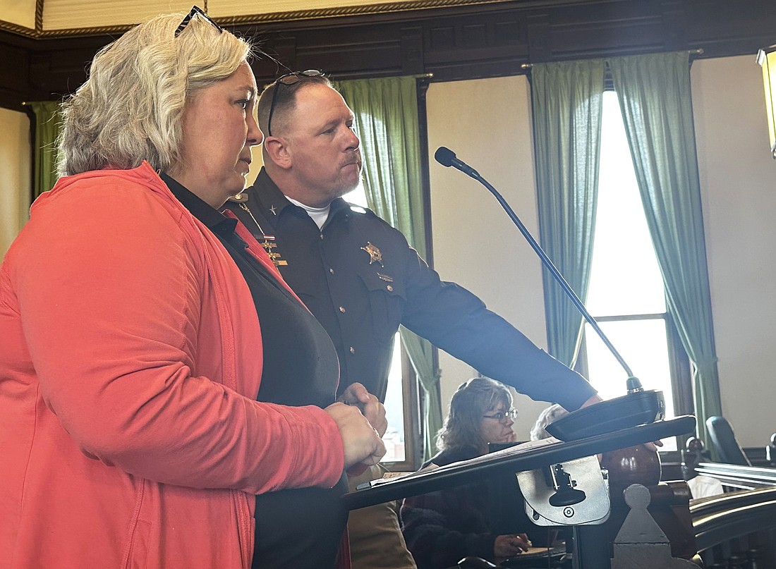 Amanda See (L), director of 911 operations, and Jim Smith (R), county sheriff, speak to the Kosciusko County Commissioners Tuesday about an agreement with a medical director for the Emergency Medical Dispatch. Photo by David Slone, Times-Union