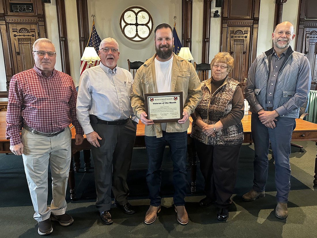 Adam Grimm is the Kosciusko County Veteran of the Month for March 2025. Pictured (L to R) are Kosciusko County Veteran Service Officer Darryl McDowell, County Commissioner Bob Conley, Grimm and County Commissioners Sue Ann Mitchell and Cary Groninger. Photo by David Slone, Times-Union