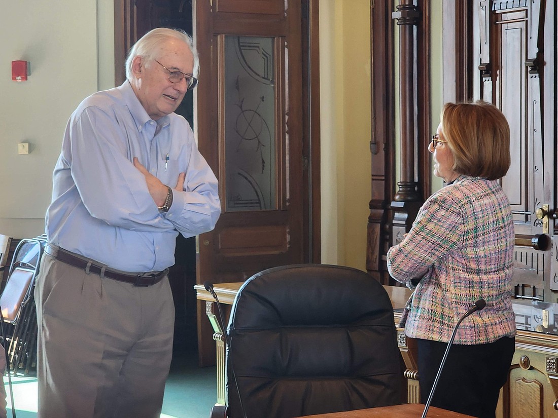 New Kosciusko County Redevelopment Commission member Dan Brown goes over some matters with fellow commission member Jan Orban prior to the commission's meeting. Photo by Deb Patterson, InkFreeNews