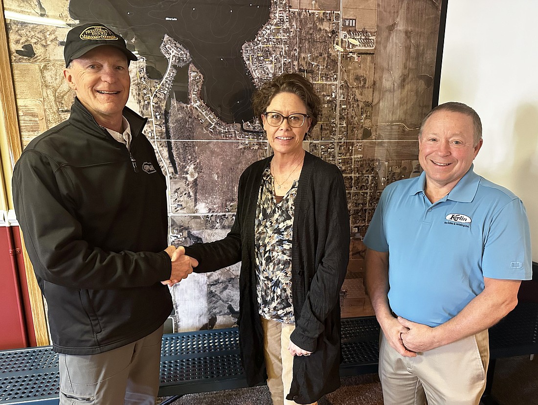 Rick and Diane Kerlin donated over 3.5 acres for the Silver Lake Community Center recently. Pictured Friday are (L to R) Rick Kerlin, Silver Lake Clerk-Treasurer Tonya Conley and Kerlin Bus President Clifford Zehr. Photo by David Slone, Times-Union