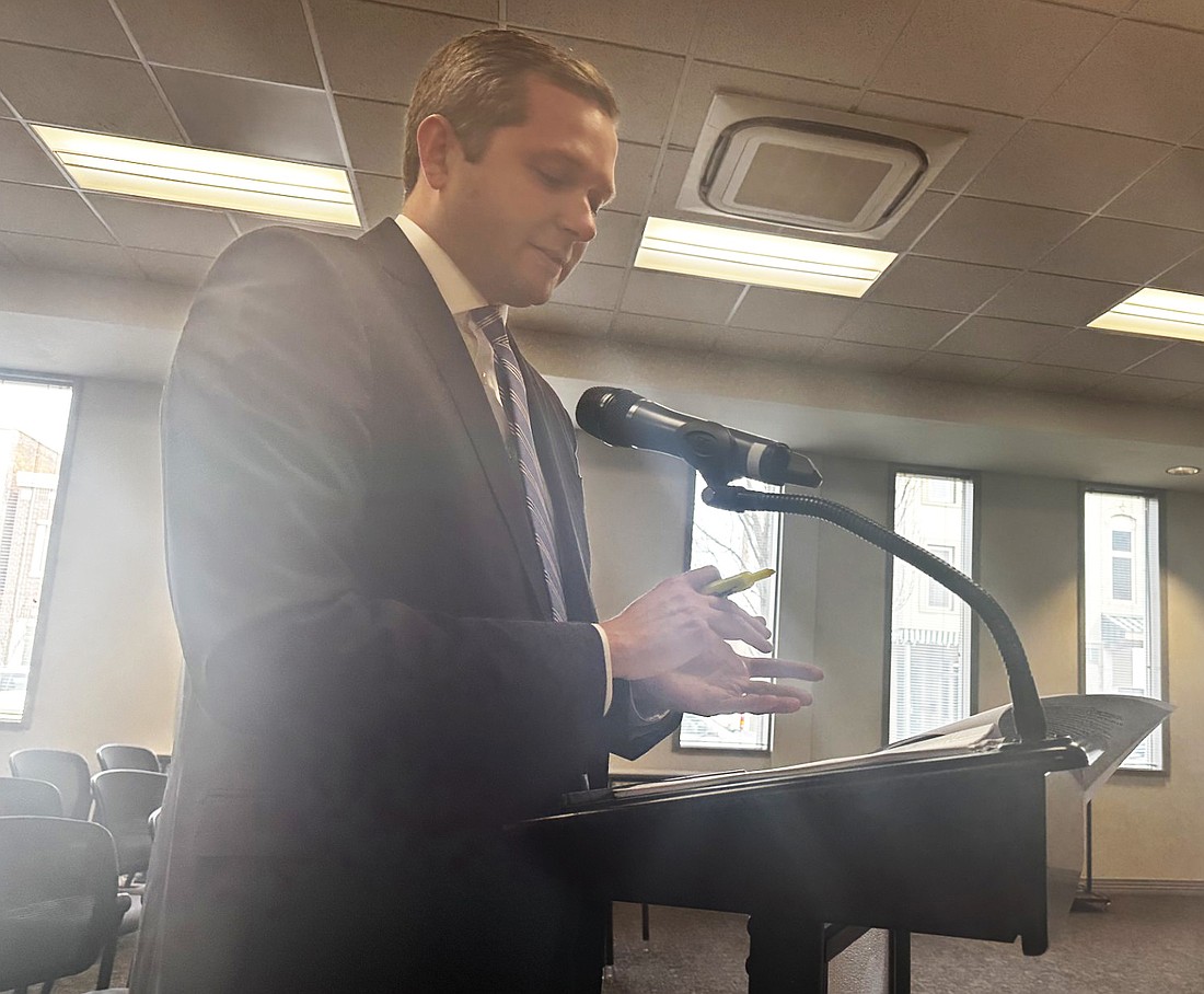 Thomas Everett, attorney with Barnes & Thornburg, explains the resolution to pledge tax increment revenues to pay the debt service on the Residential Infrastructure Fund bond to the Warsaw Redevelopment Commission on Monday. Photo by David Slone, Times-Union