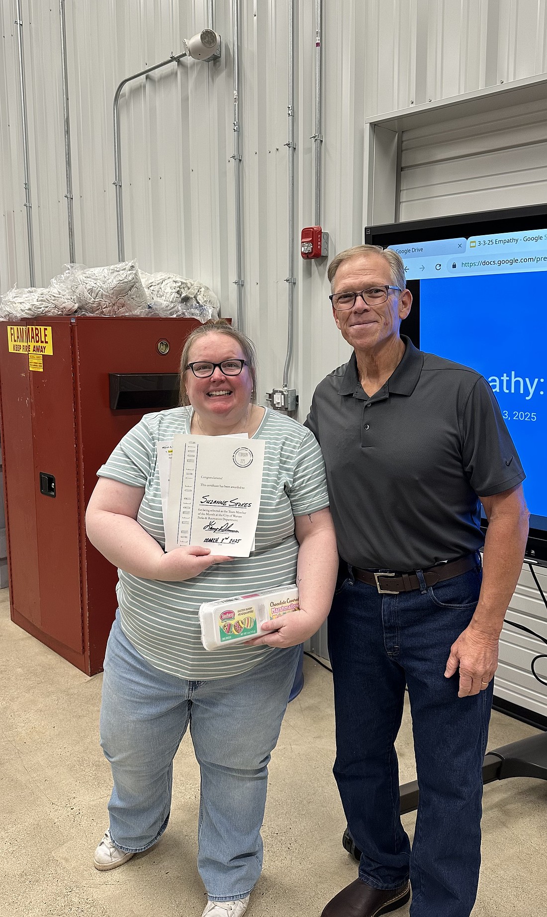 Warsaw Parks and Recreation Department administrative assistant Suzanne Stokes (L) was named the February Team Member of the Month. Shown with her is Warsaw Parks and Recreation Department Superintendent Larry Plummer. Photo Provided