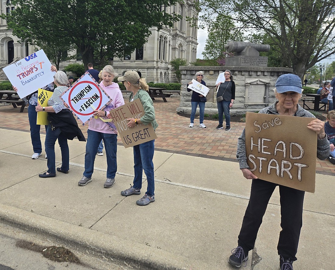 Protestors rally in front of the old county courthouse Thursday. Photo by Jackie Gorski, Times-Union