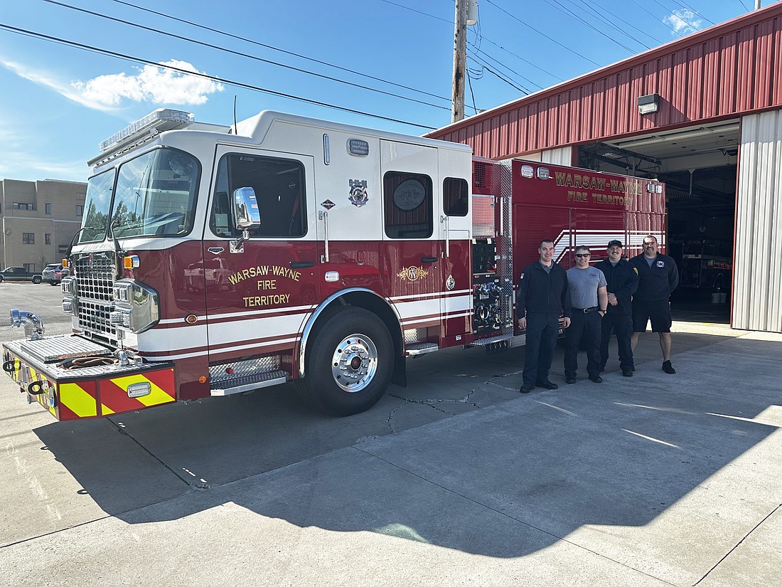 The fire engine ordered by the Warsaw-Wayne Fire Territory in 2022 arrived Friday. Pictured (L to R) in front of the engine are Chief Joel Shilling, Lt. Brandon Allen, Kegan O’Brien and Myles Scott. Photo by David Slone, Times-Union