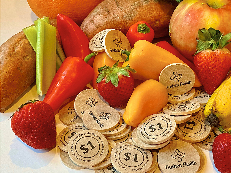 Sprouts Kids Club tokens are pictured with produce.
Photo Provided