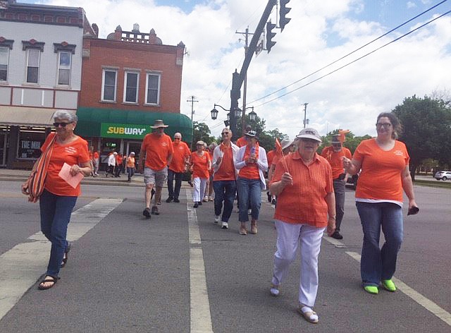 Area residents are invited to wear orange at noon Friday, June 6 in North Manchester and join the second annual walk and vigil to raise awareness about gun violence. Pictured is the walk from the 2024 walk. Photo Provided