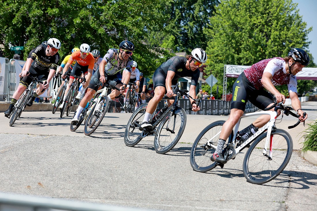 Road racers navigate the first turn of the criterium loop. Photo Provided