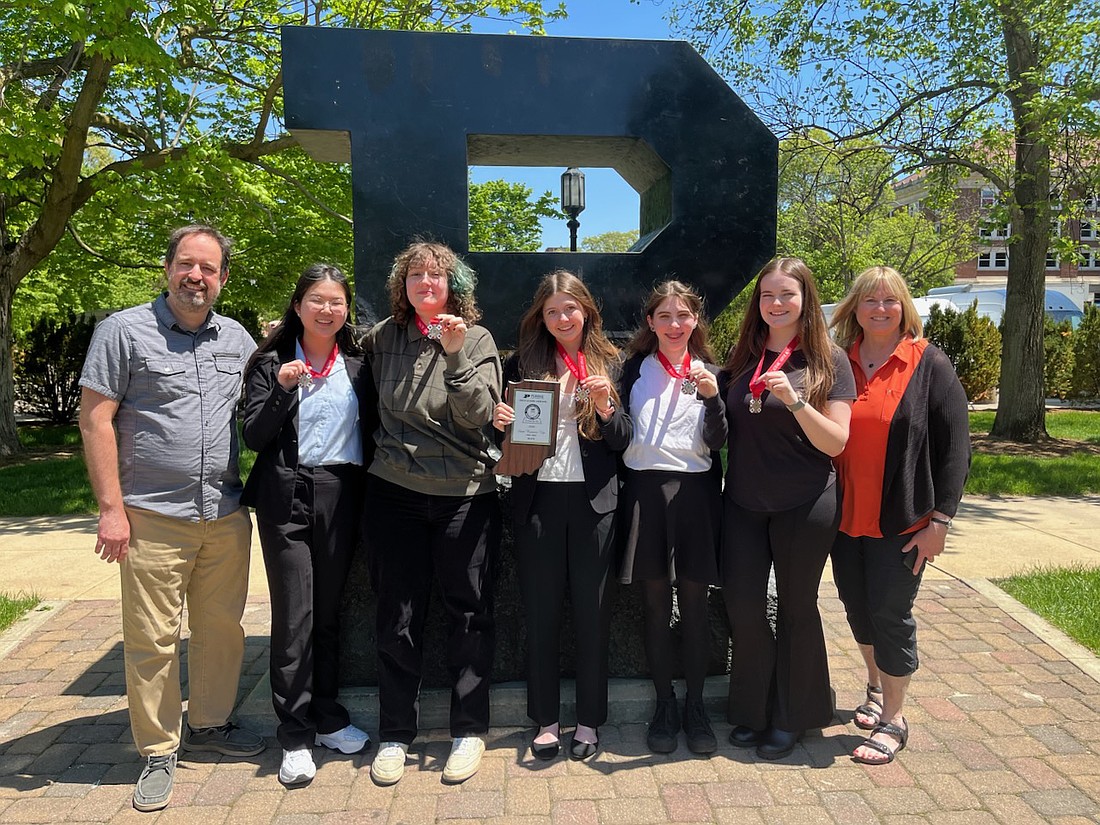 Pictured (L to R) are coach Chuck Wiebe, Giusi Zheng, Finn Brander, Bronwyn Poch, Audrie Winey, Chloe Clemons and coach Barb McCollom. Photo Provided