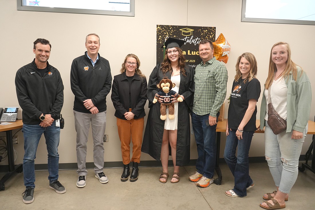 Pictured (L to R) are Tim Devlin, Warsaw Community High School assistant principal; Dr. David Hoffert, Warsaw Community Schools superintendent; Sarah Roberts, WCHS counselor; Makia Lucas; Pete Barnet, WCHS graduation coach; Holly Ault, WACC program coordinator; and Taylor Myers, Region 2 JAG coordinator. Photo provided.