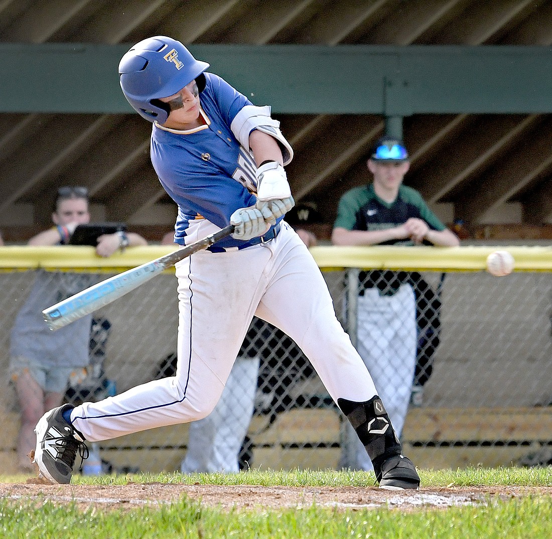 Triton freshman Blake Ousley comes around on the pitch to hit a single in the second inning...Nieter
