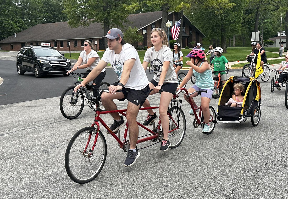 Four of the 650 participants in the Fat & Skinny Tire Festival Community Mass Ride found a way to ride together. Photo by David Slone, Times-Union