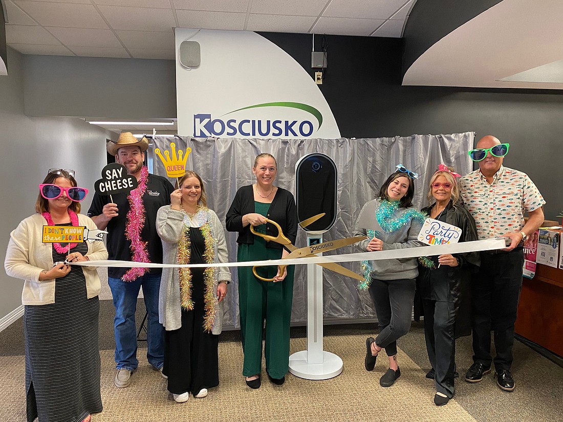 The Kosciusko Chamber of Commerce had a ribbon-cutting for Capture the Moments Photo Booth on Wednesday. Pictured (L to R) are Chamber Ambassadors Melissa Paxton, Tim Frame and Kyrie Maierle; owner Athena Stenstrom; Chamber Ambassadors Kristi Jackson Hull and Stacey Leek; and Chamber Community Engagement Specialist Scott Wiley. Photo by Leah Sander, InkFreeNews