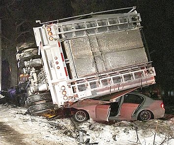 Truck Flips On Car; No Serious Injuries
