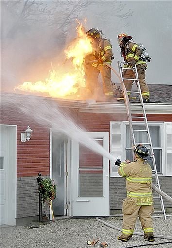 Firefighters Team Up To Limit Fire Damage