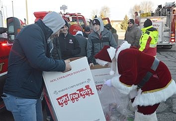 Volunteers Help Make Toys For Tots Toy Drive Run Smoothly