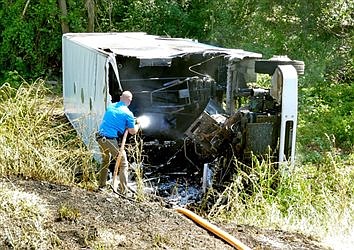 Truck Catches Fire After Overturning